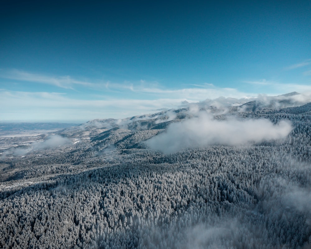 an aerial view of a snowy mountain range