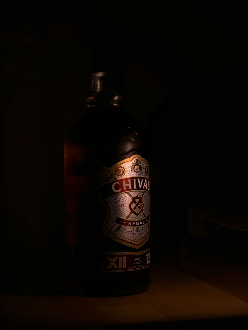 a bottle of alcohol sitting on top of a table