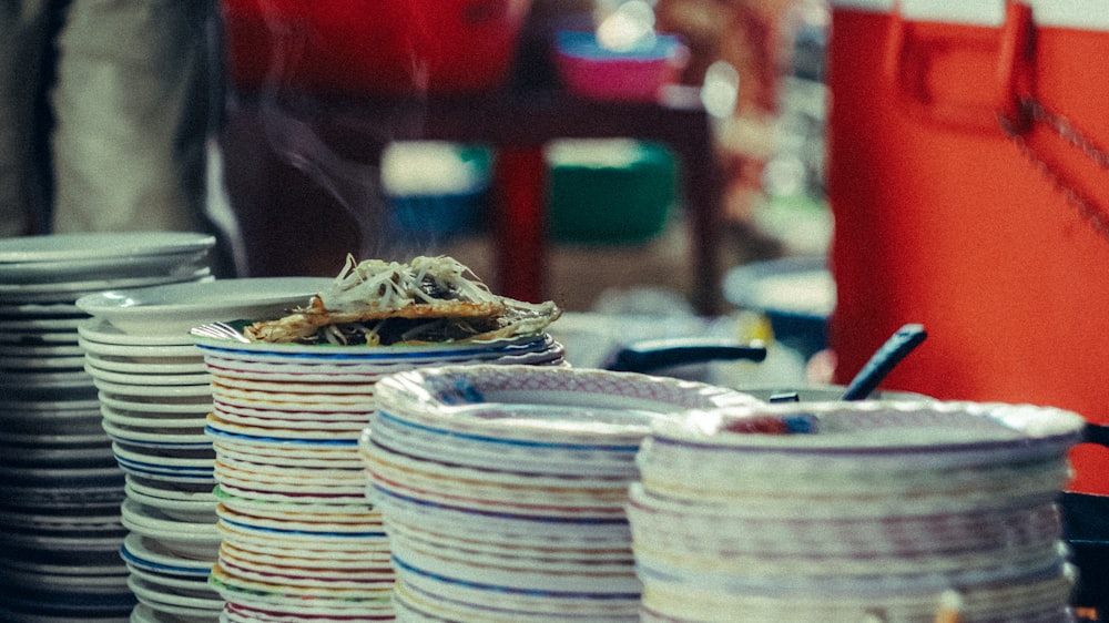 a table topped with lots of plates and bowls