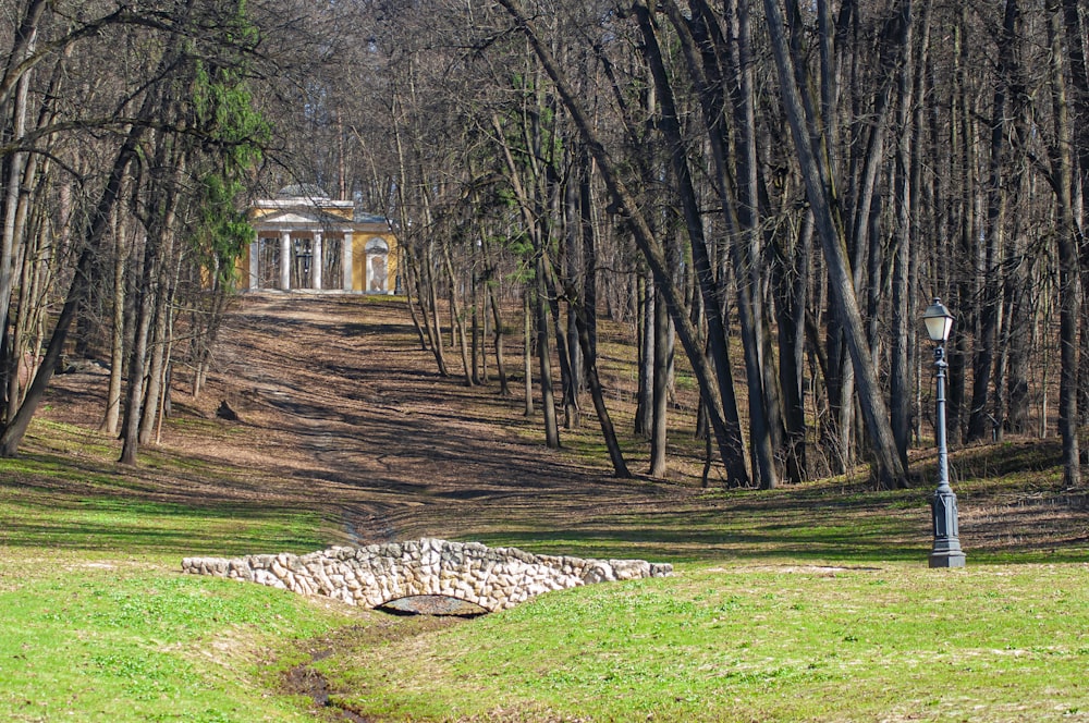 a gazebo in the middle of a wooded area