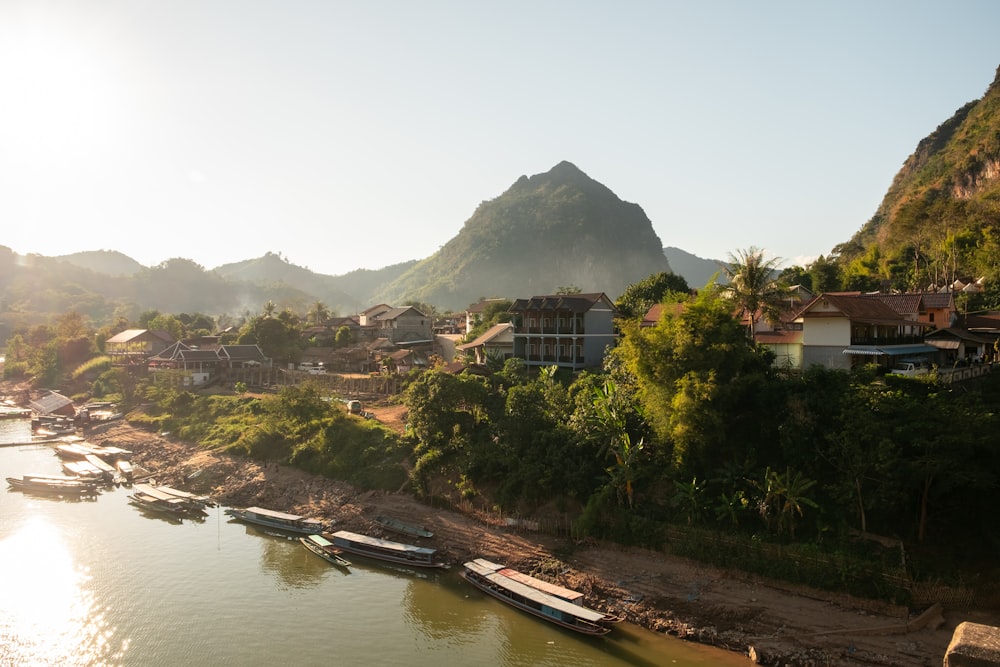 a group of boats floating on top of a river