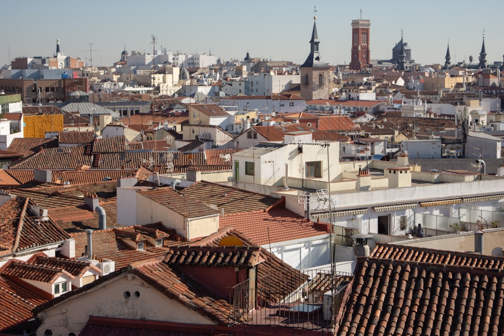 a view of a city with rooftops and tall buildings