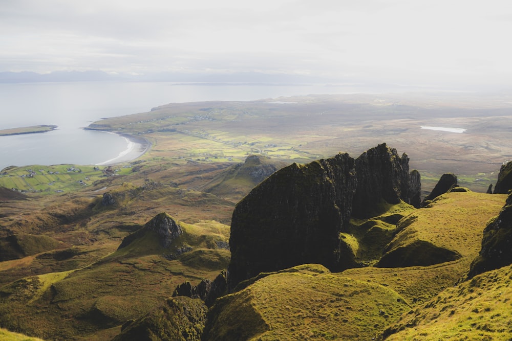 a view of a mountain range with a body of water in the distance