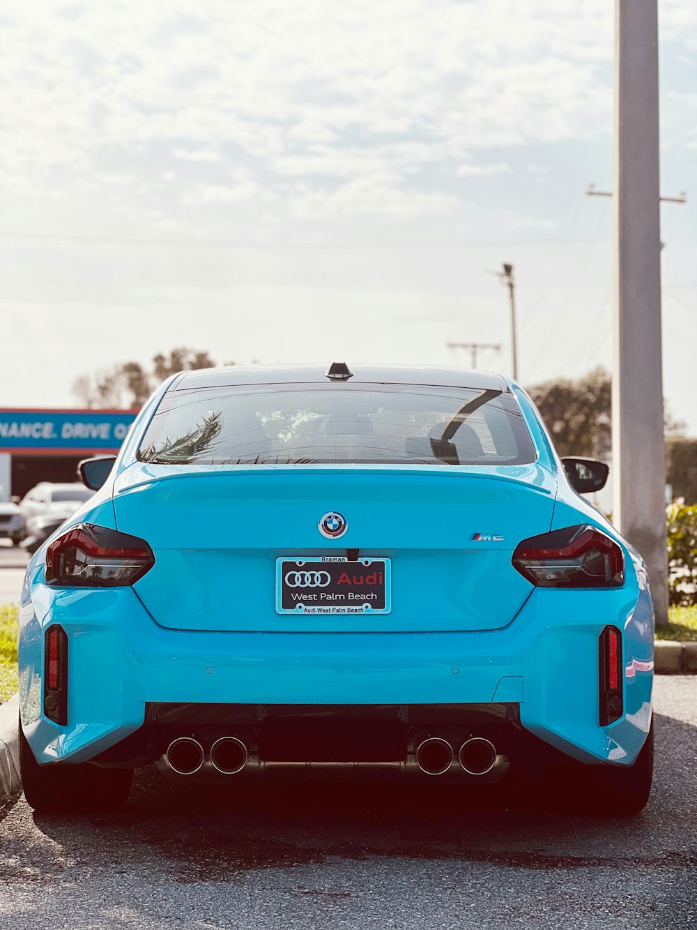 a blue car parked in a parking lot