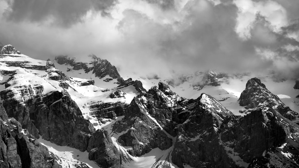 a black and white photo of a mountain range