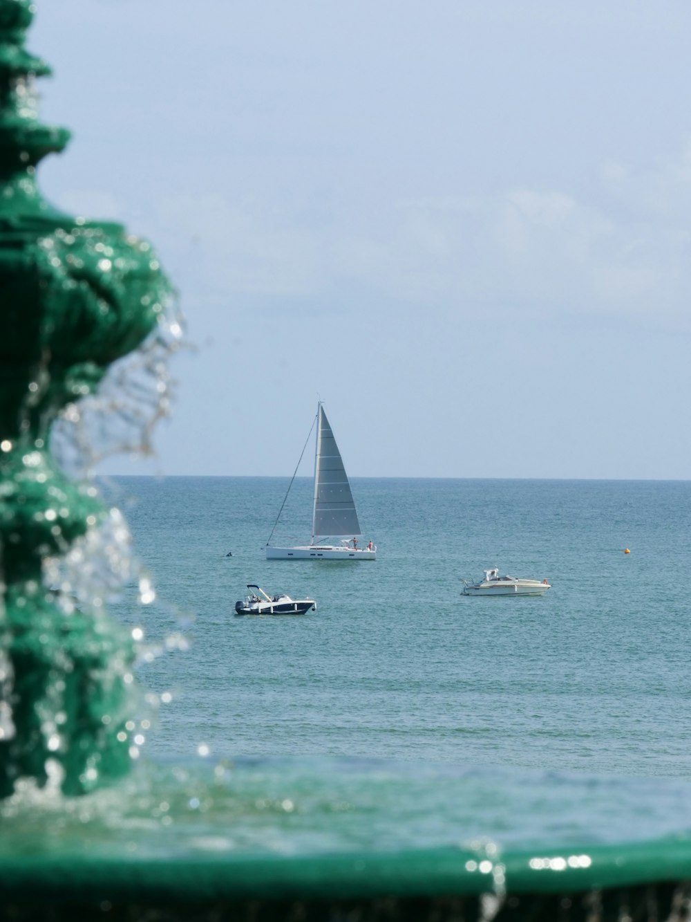 a view of a sailboat out on the water