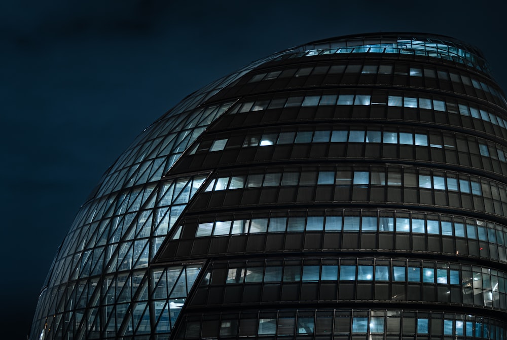 a very tall building with lots of windows at night