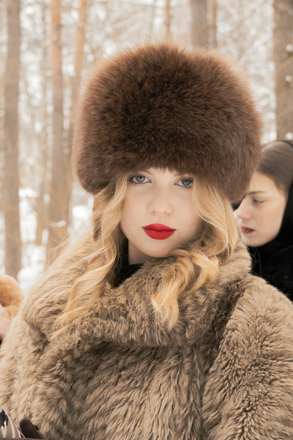 a woman wearing a fur hat and a fur coat