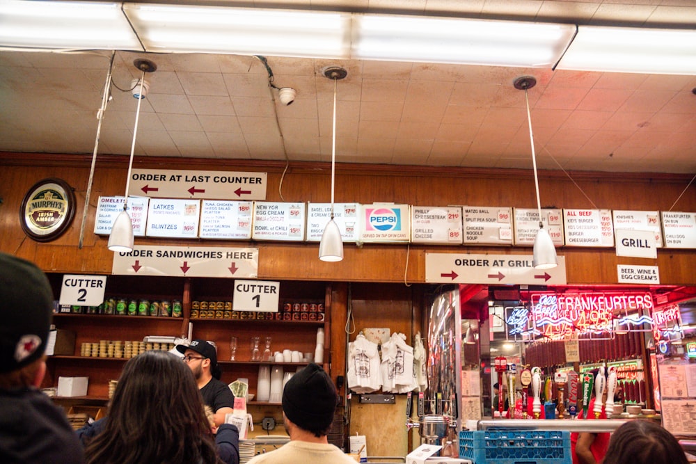 a group of people standing around a store