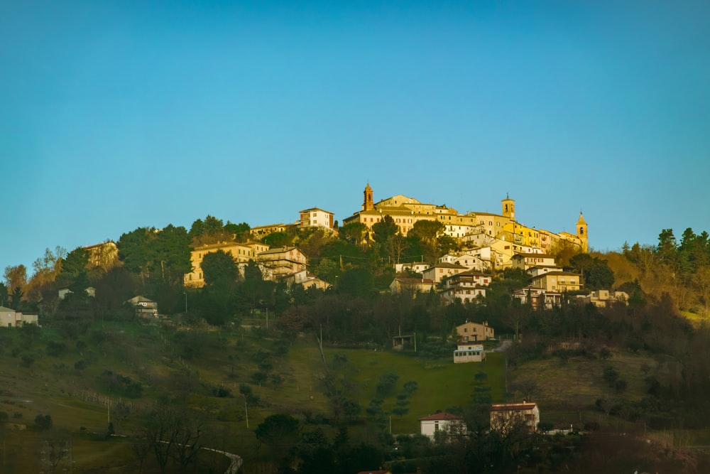 a hill with a village on top of it