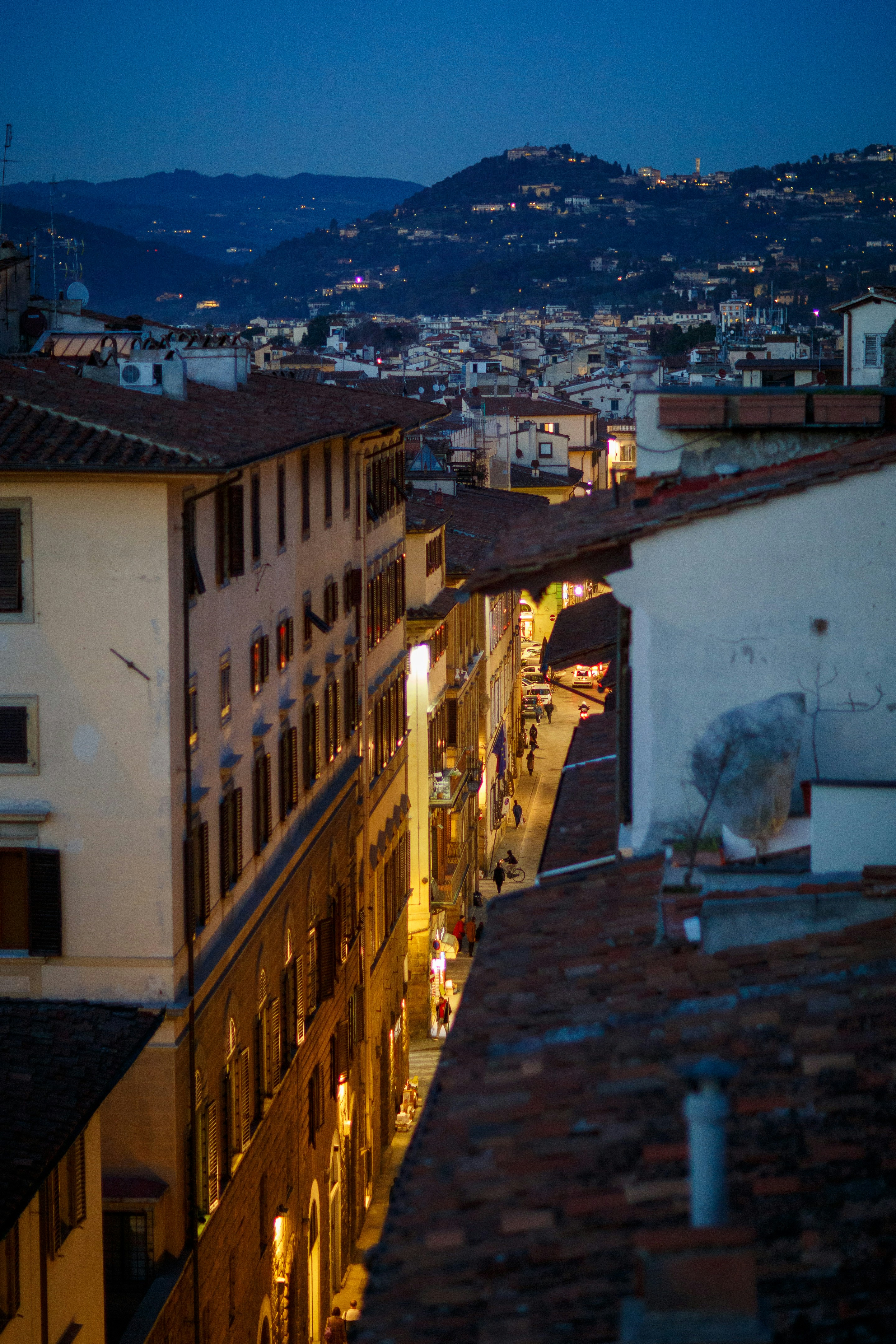 A view of a city at night from a rooftop photo – Free Via dei benci ...