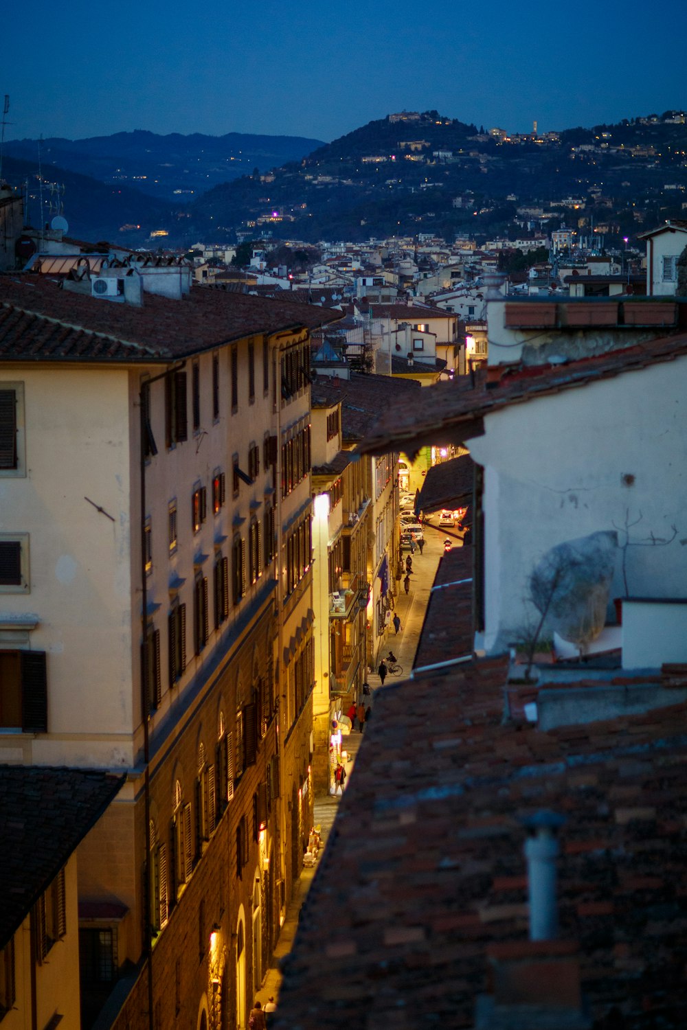 a view of a city at night from a rooftop