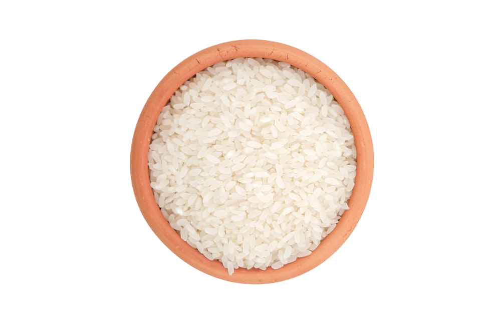 a bowl of rice on a white background