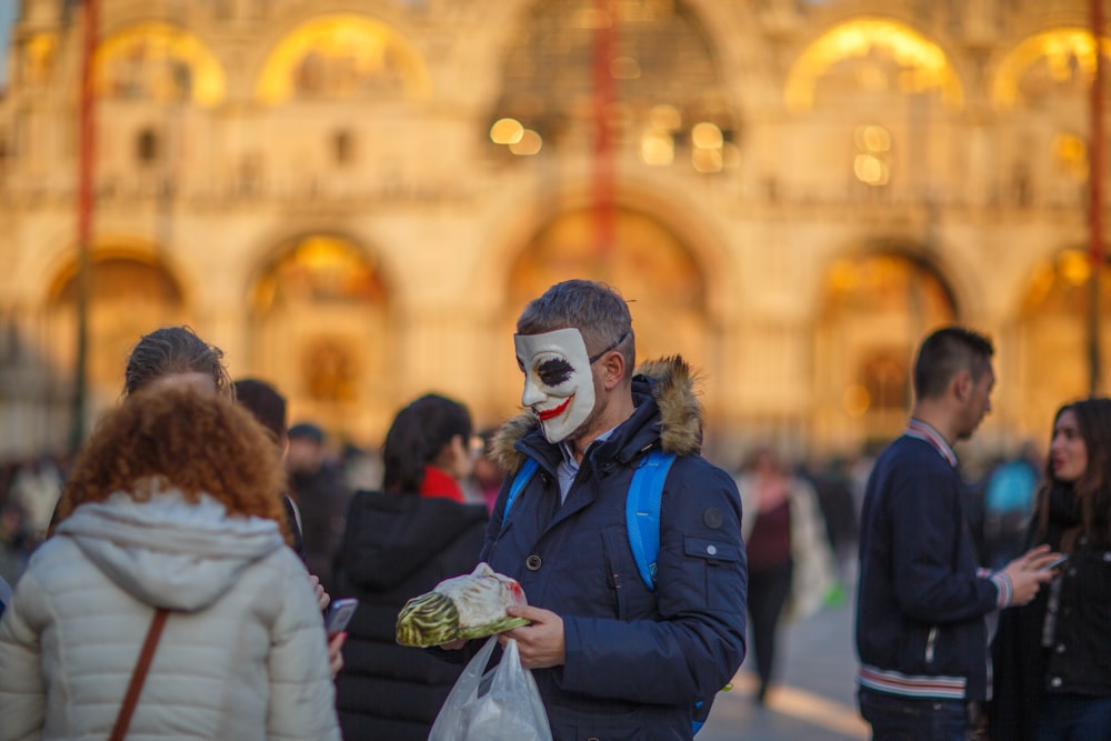 a man with a clown face painted on his face