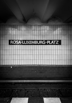 a black and white photo of a subway station