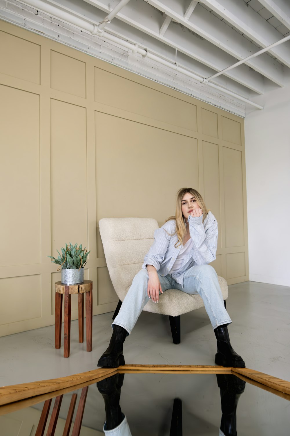 a woman sitting on a chair in a room