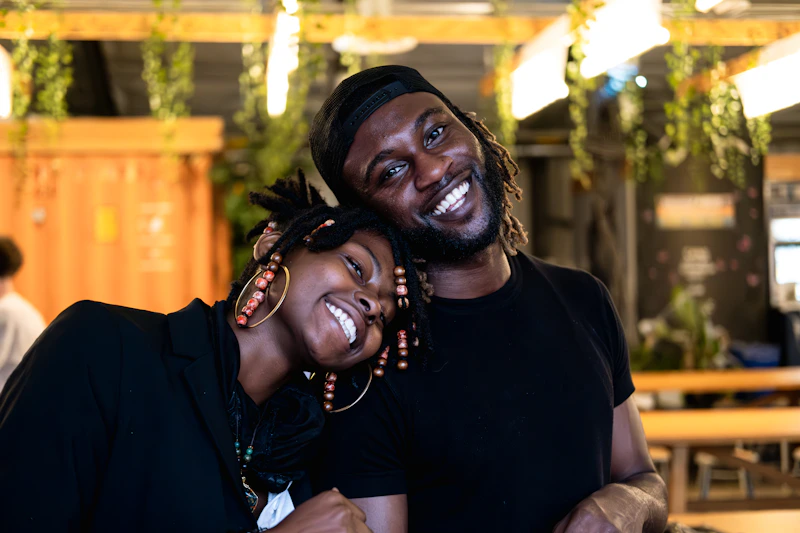 smiling man and woman posing for the camera