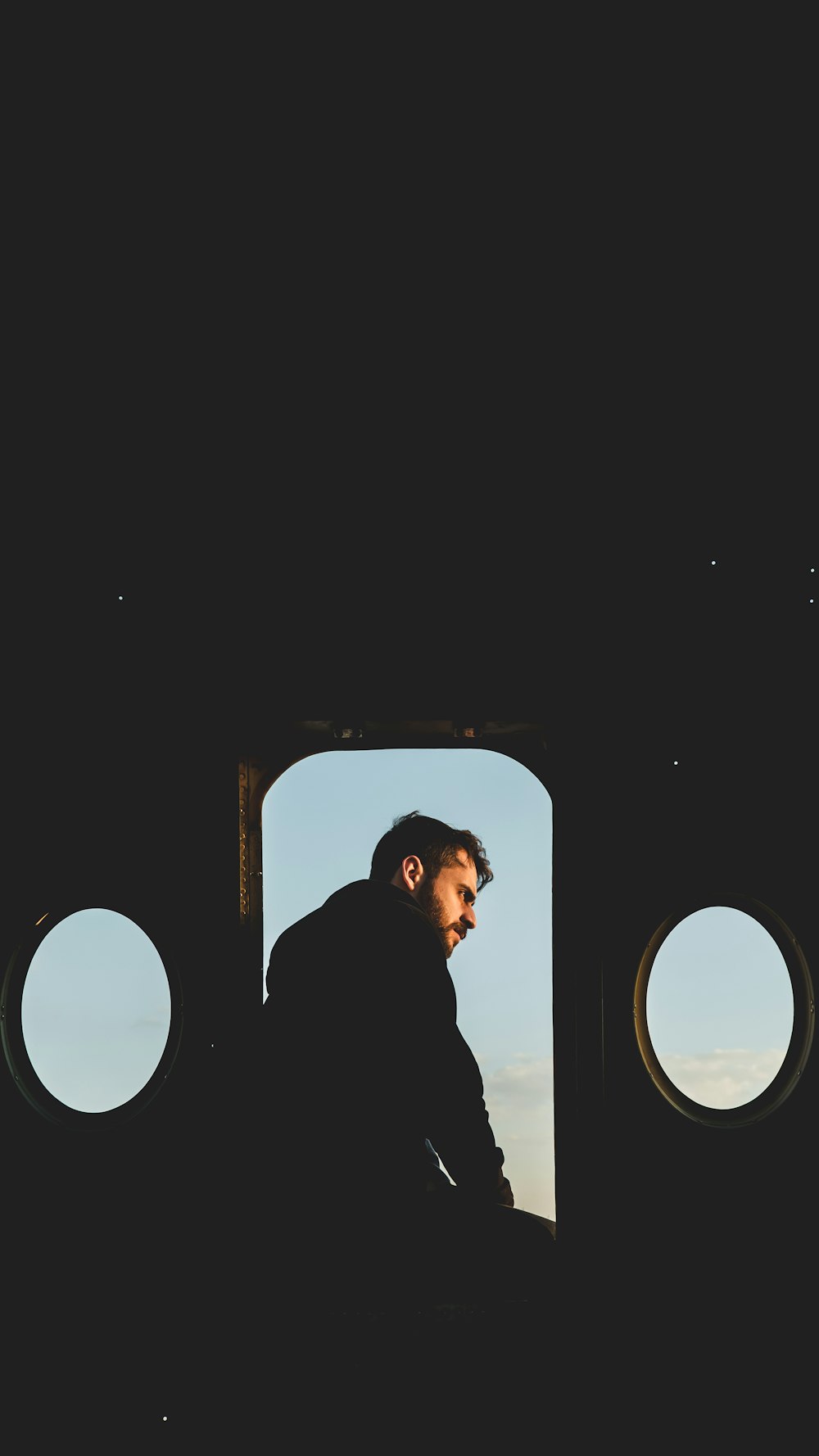 a man looking out of an airplane window