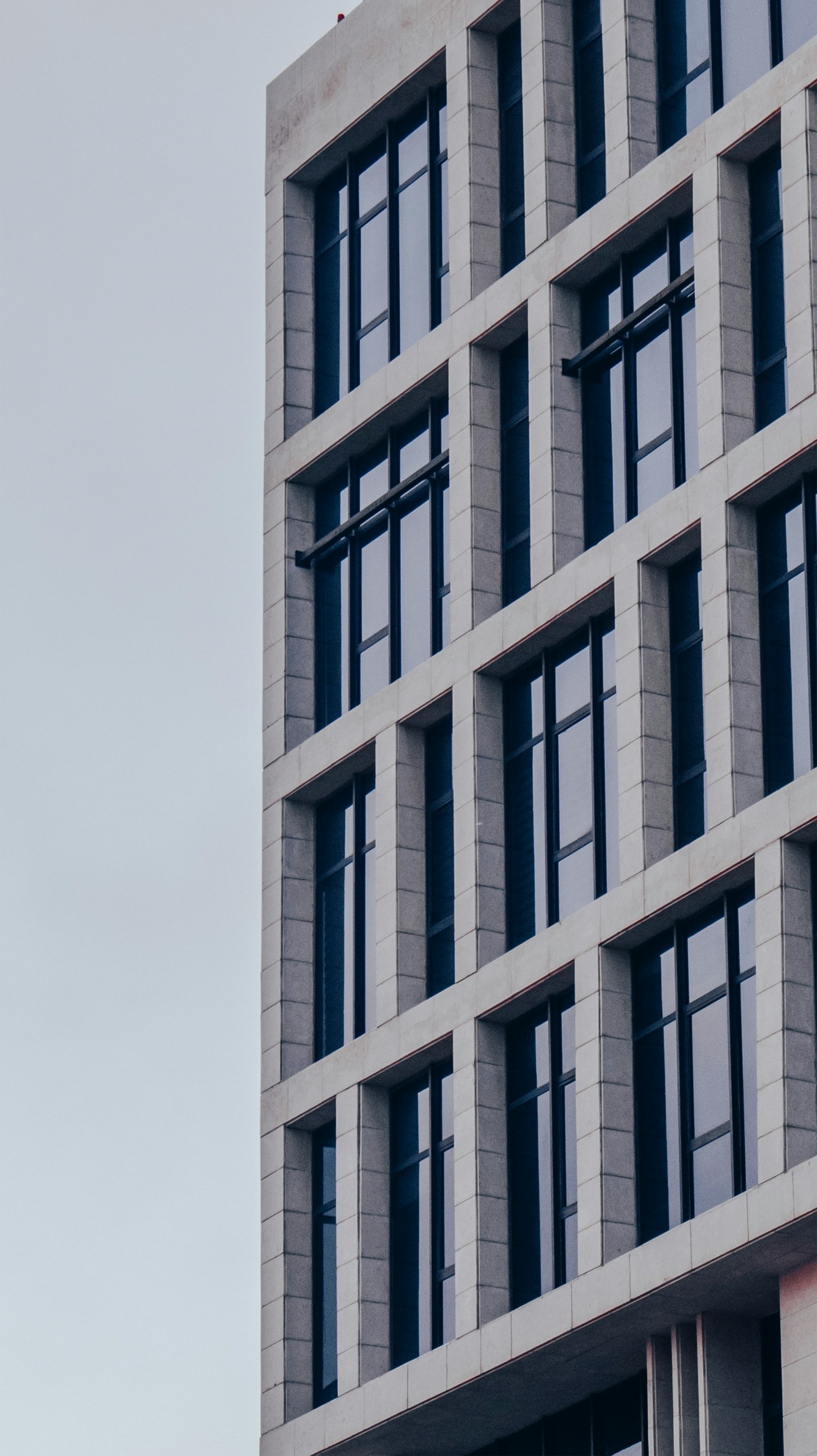 a tall building with a clock on the side of it