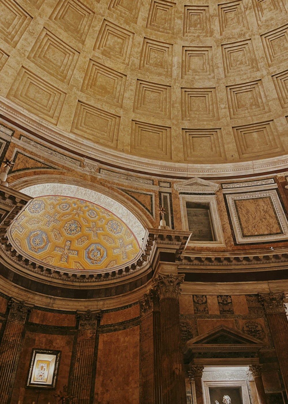 the ceiling of a large building with a dome