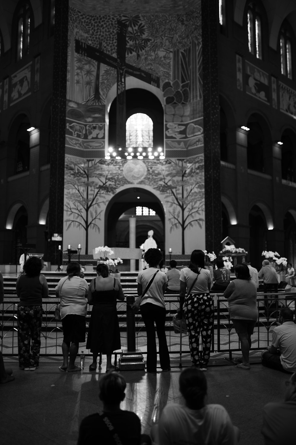 a group of people standing in front of a church