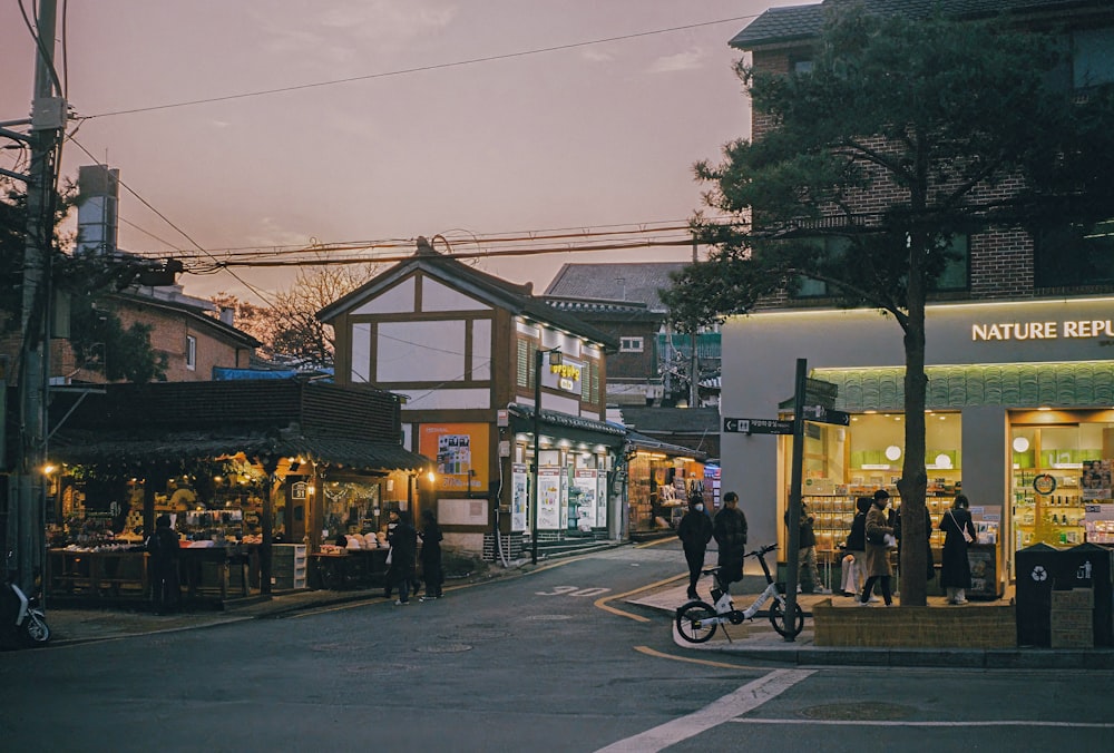 a person riding a bike down a street