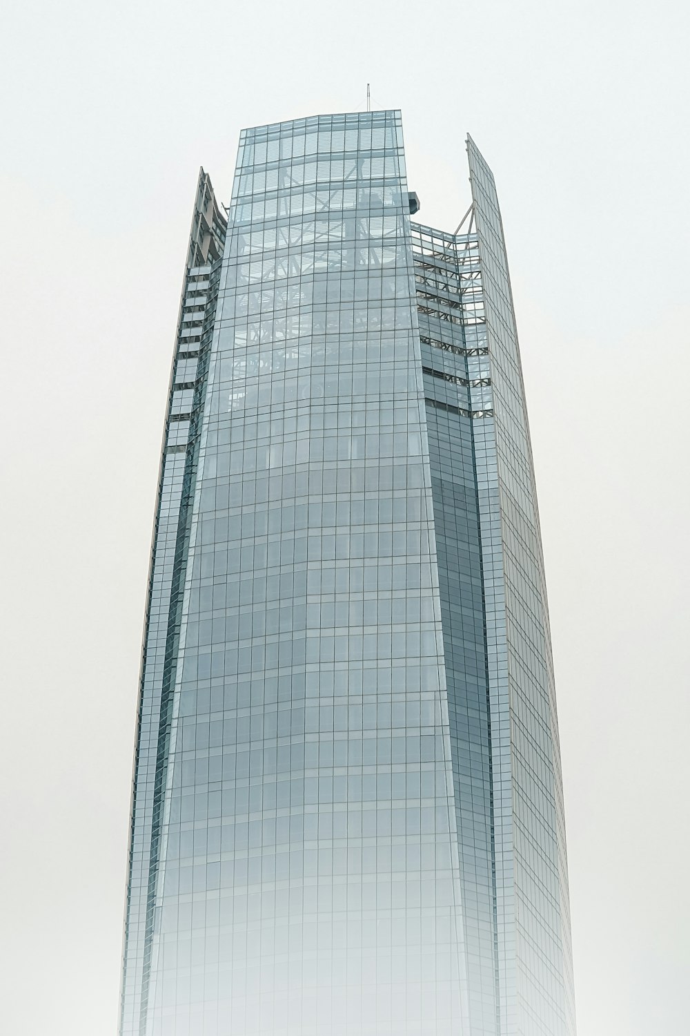 a very tall building with a clock on it's side