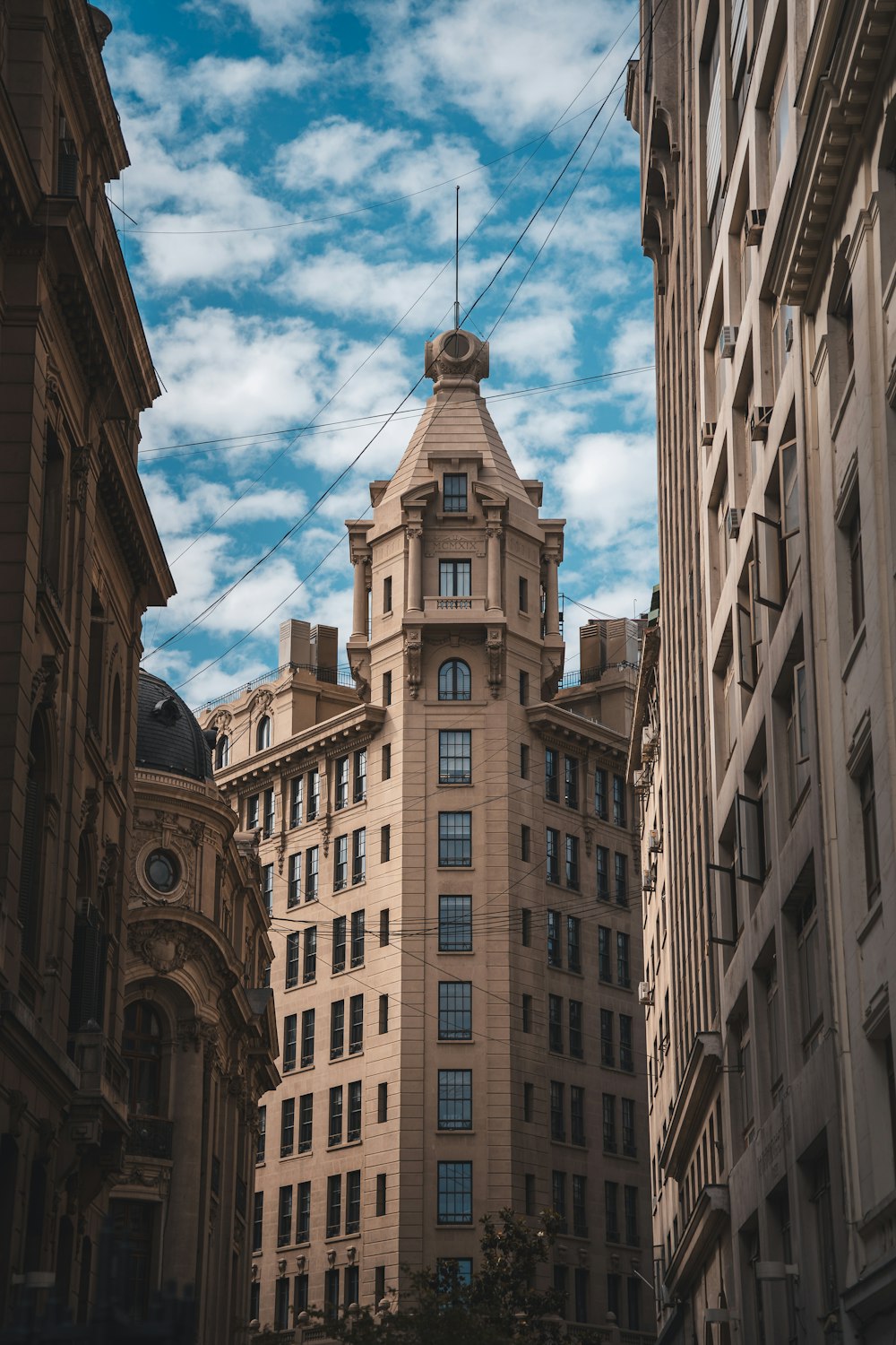 a tall building with a clock on the top of it