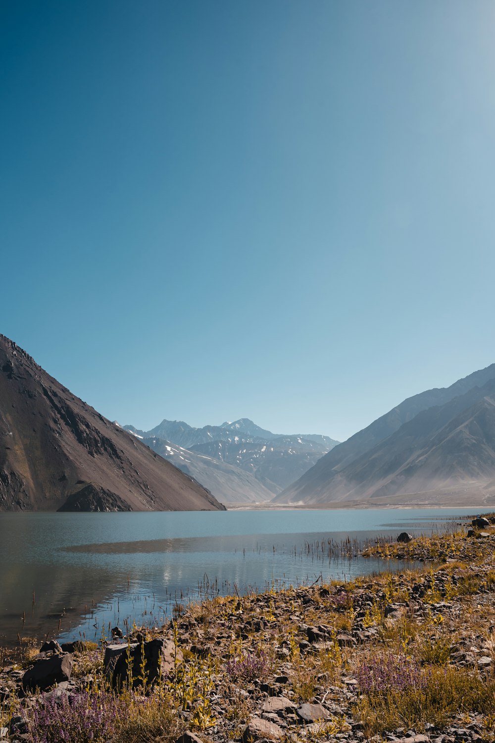 a large body of water surrounded by mountains