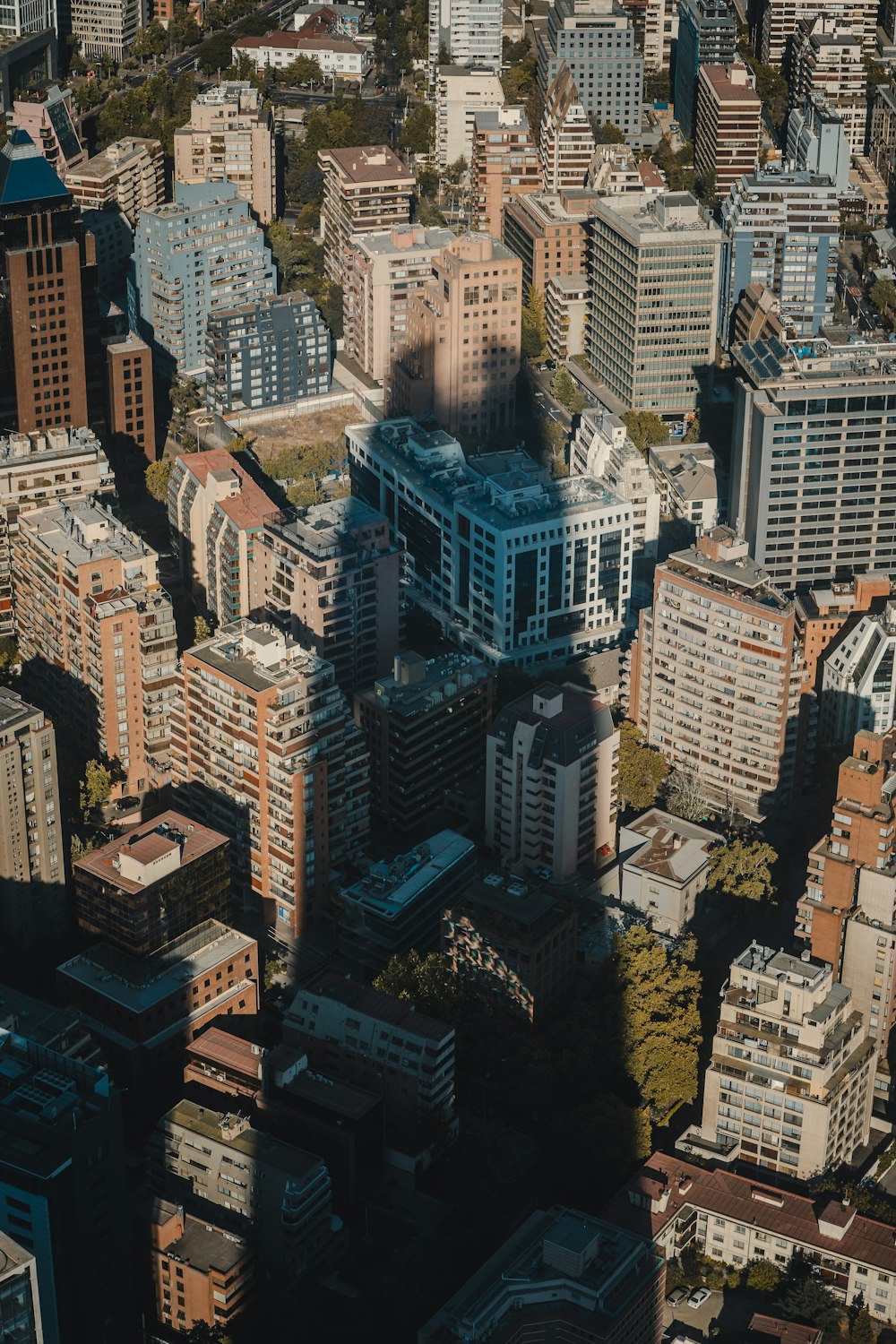 an aerial view of a city with tall buildings