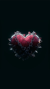 a broken heart with a chain attached to it