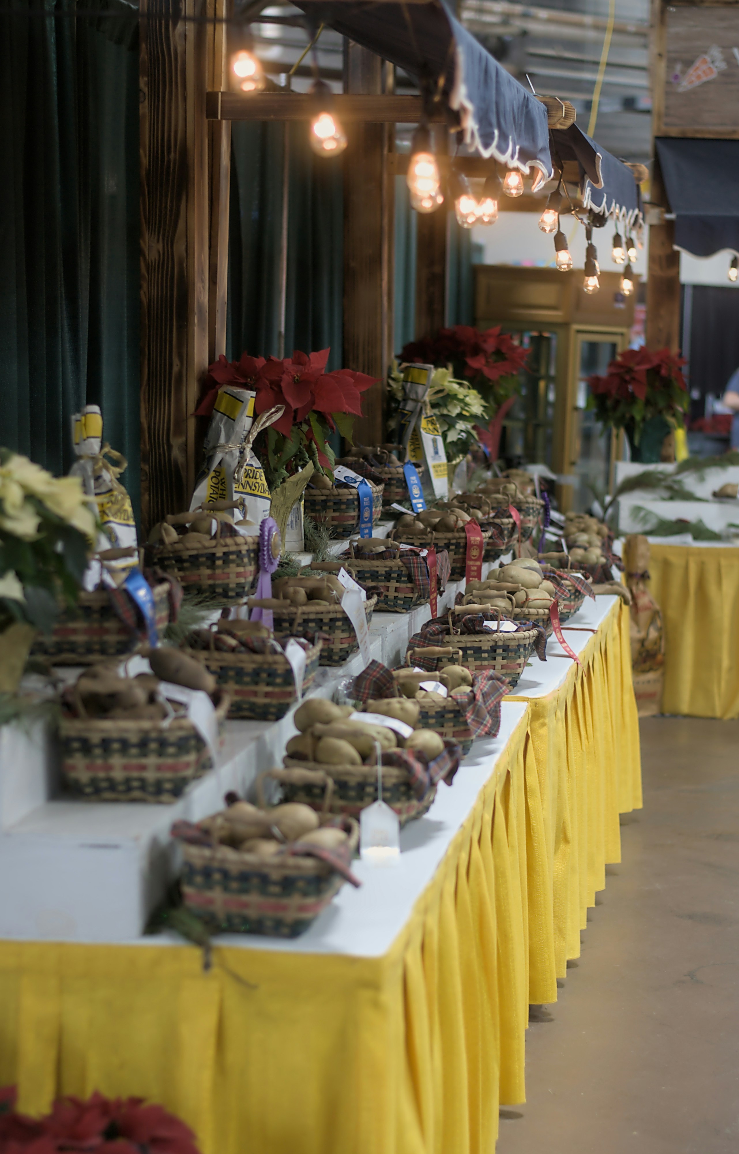 a long table with baskets of food on it