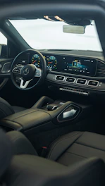 the interior of a car with a steering wheel and dashboard