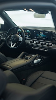 the interior of a car with a steering wheel and dashboard