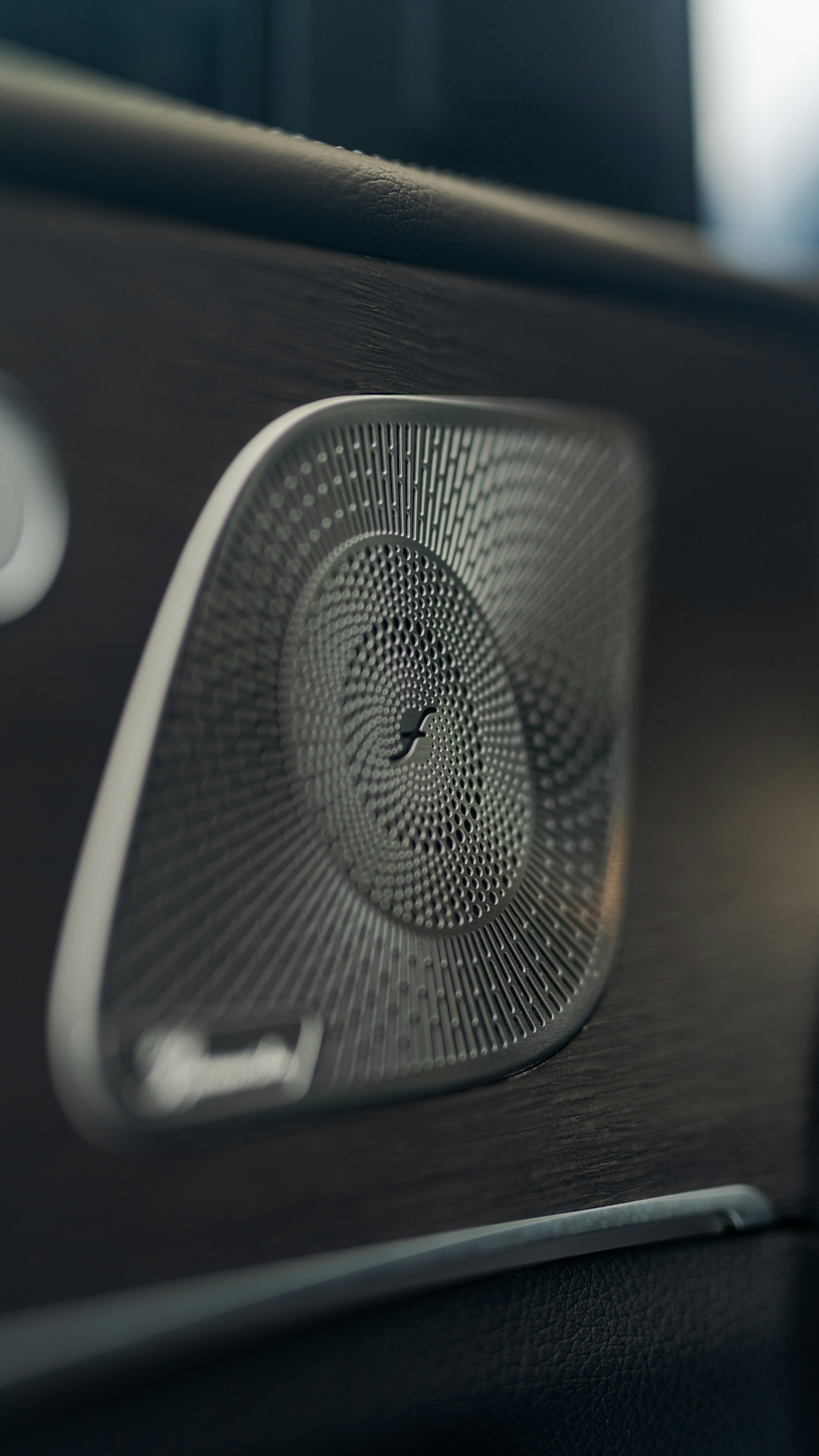a close up of a speaker in a vehicle