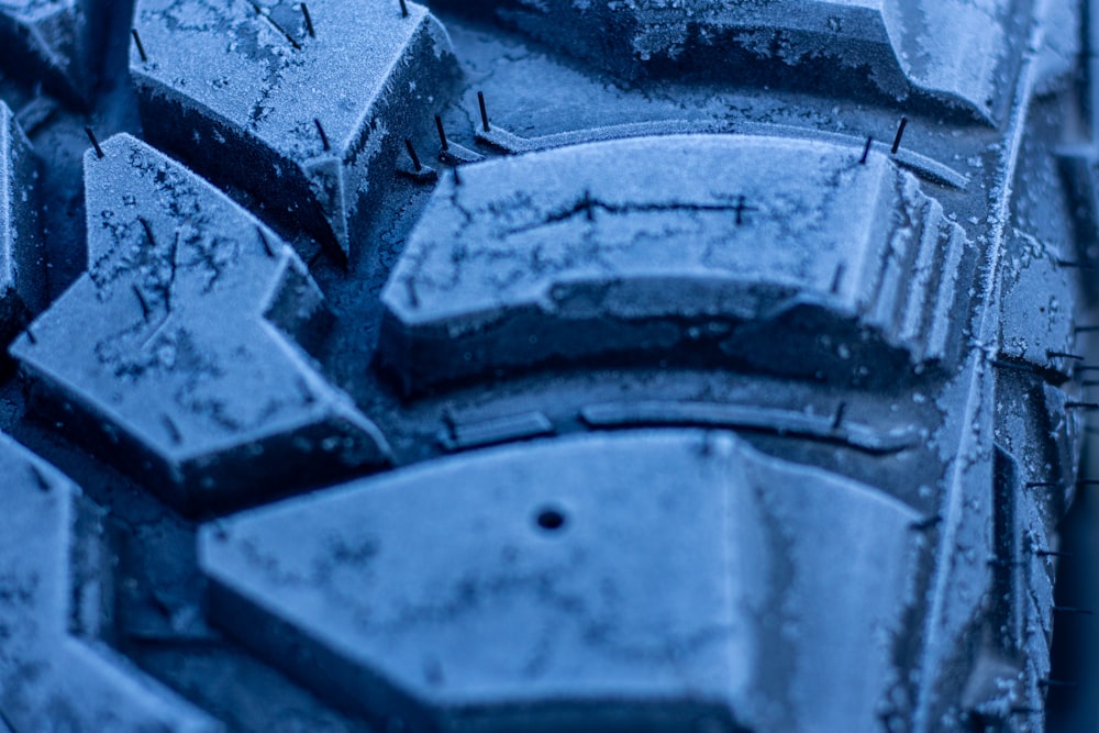 a close up of a tire with snow on it