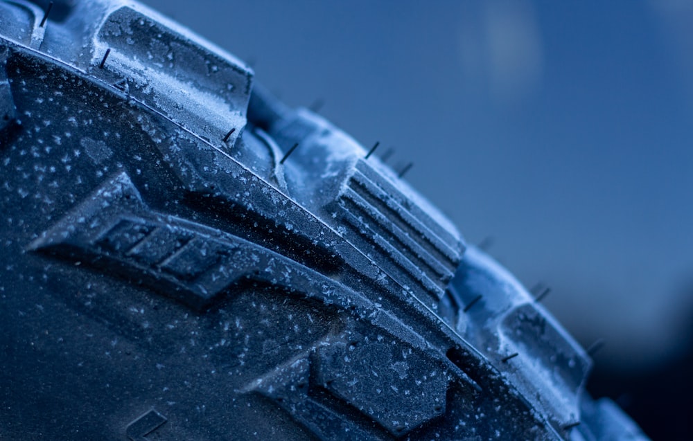 a close up of a tire with snow on it
