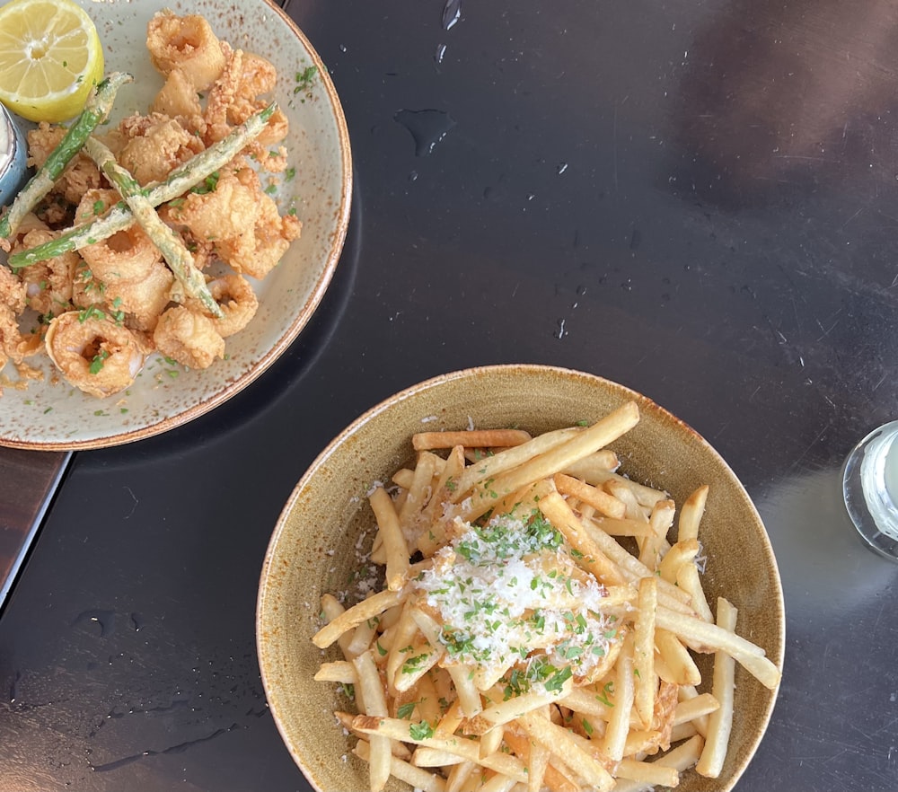 a couple of plates of food on a table