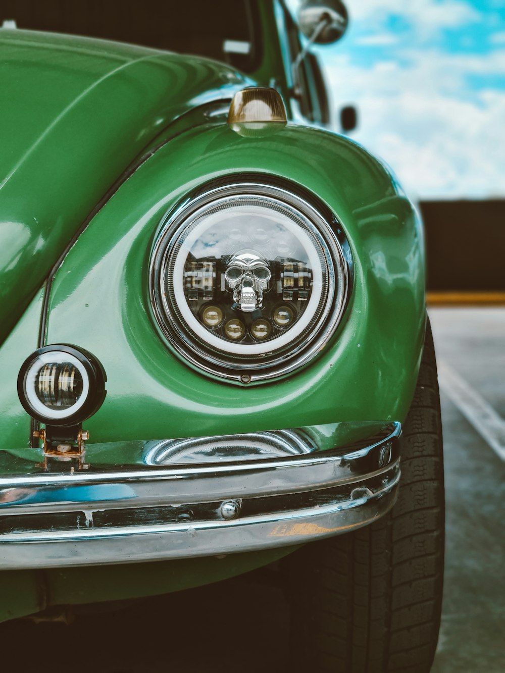 a close up of the front of a green car