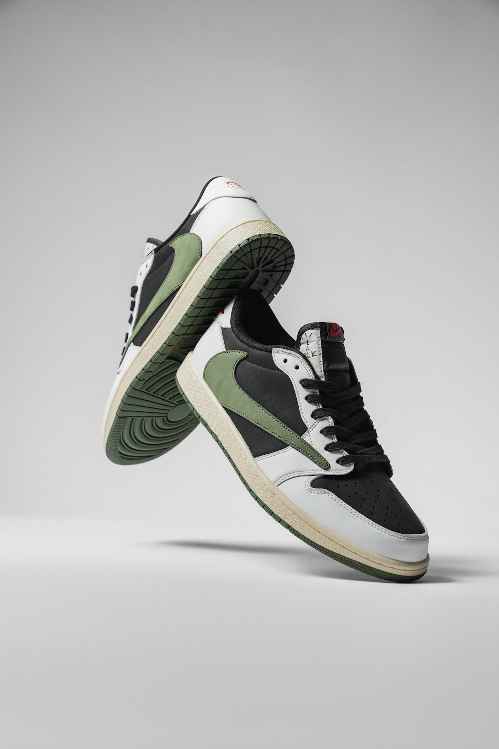 a pair of black and green sneakers