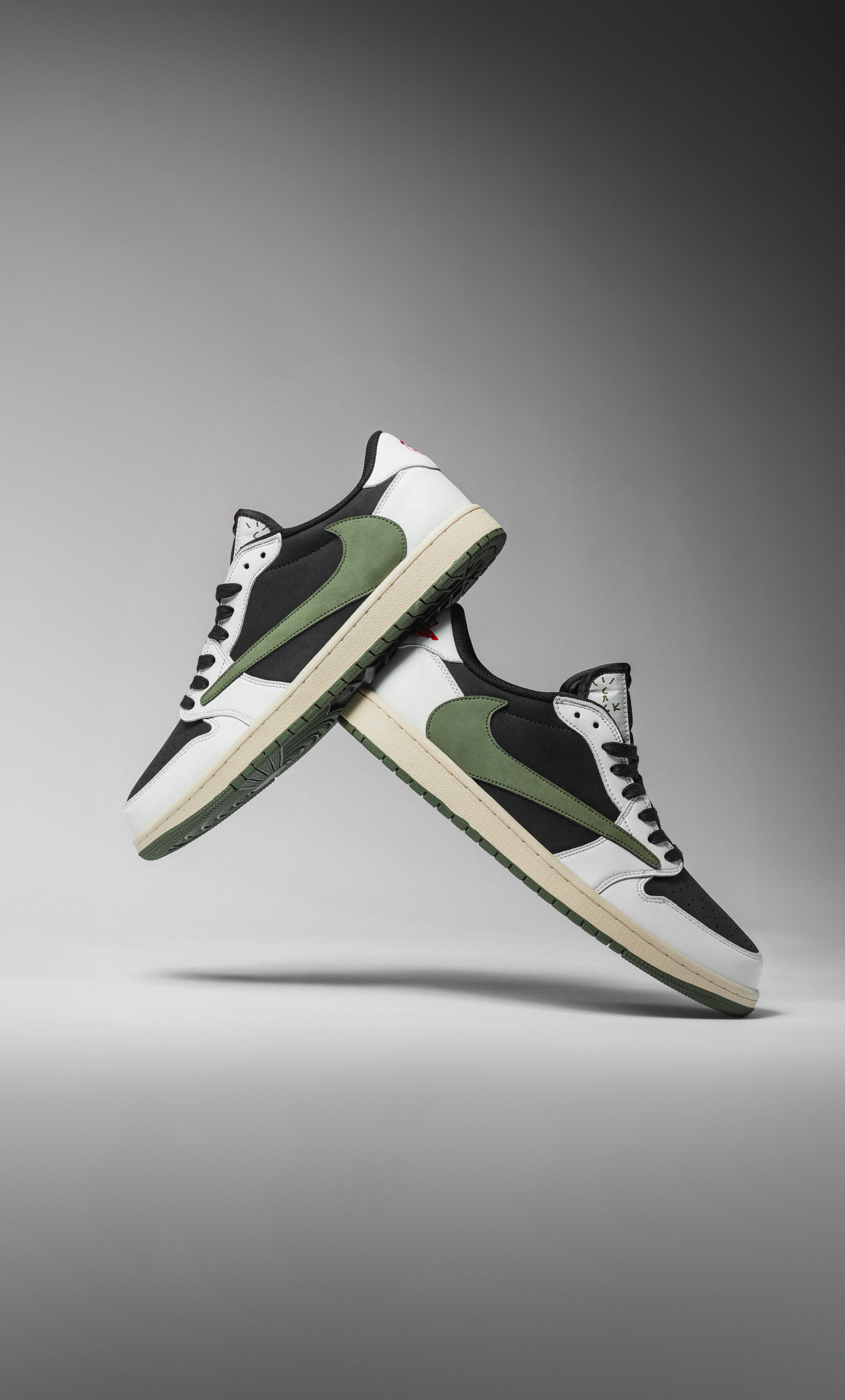 A pair of black and white sneakers with green accents photo Free Tx Image on Unsplash