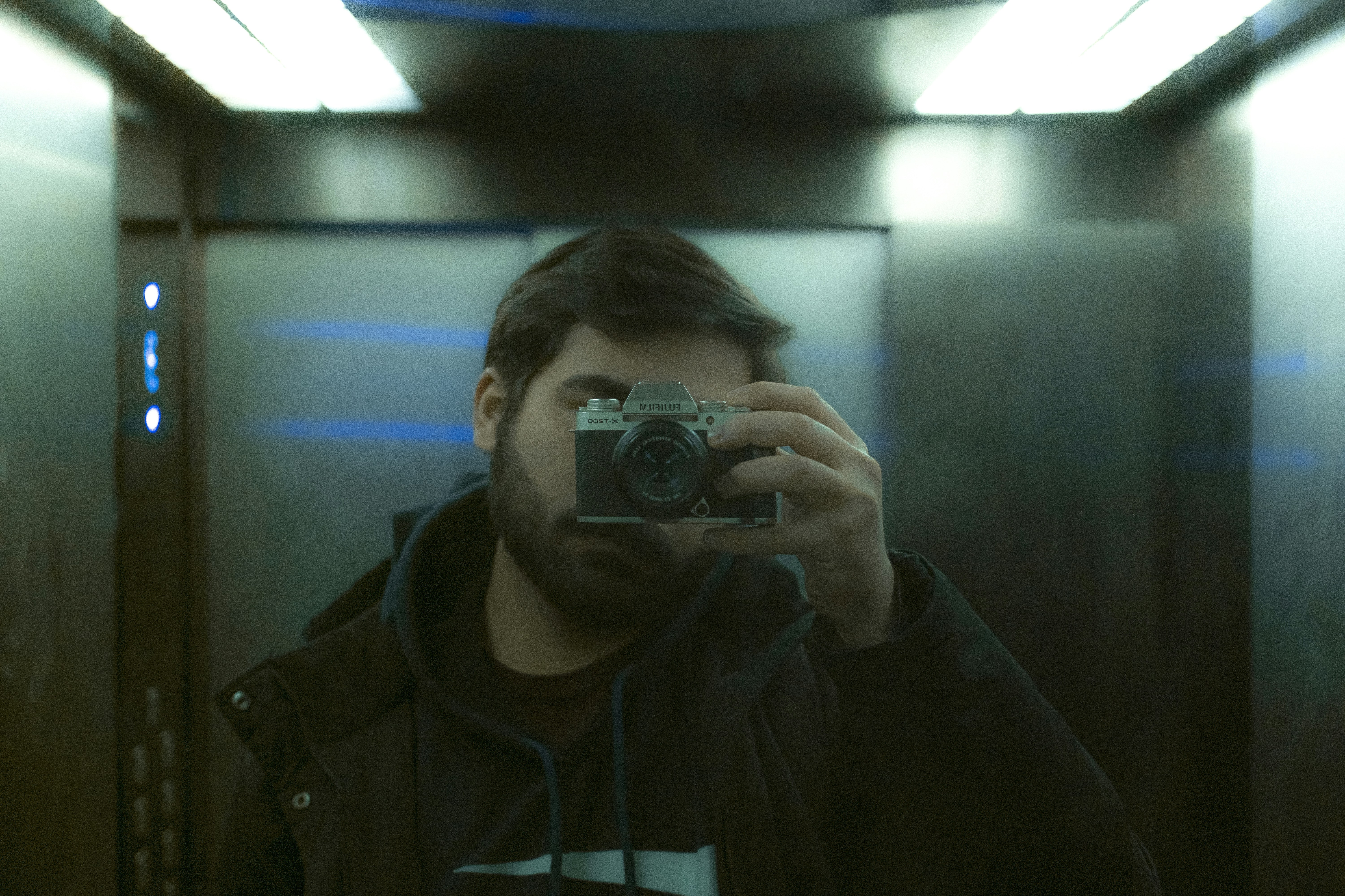 a man taking a picture of himself in a mirror