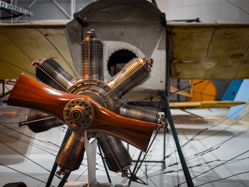 a wooden propeller sitting on top of a metal stand