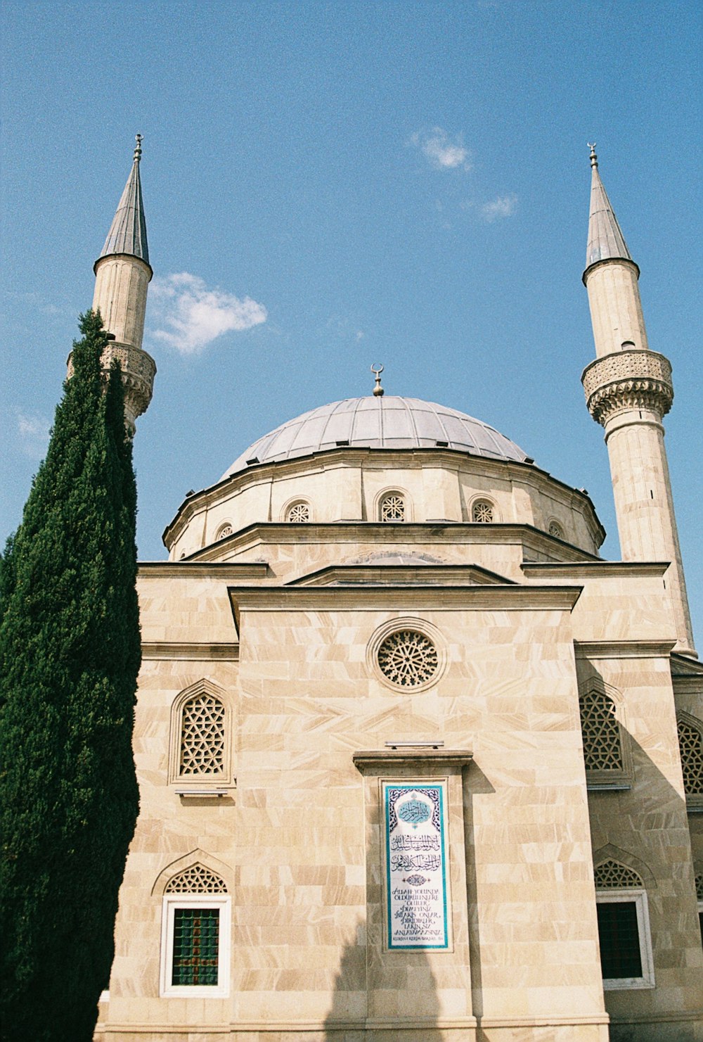 a large building with two towers and a clock on it