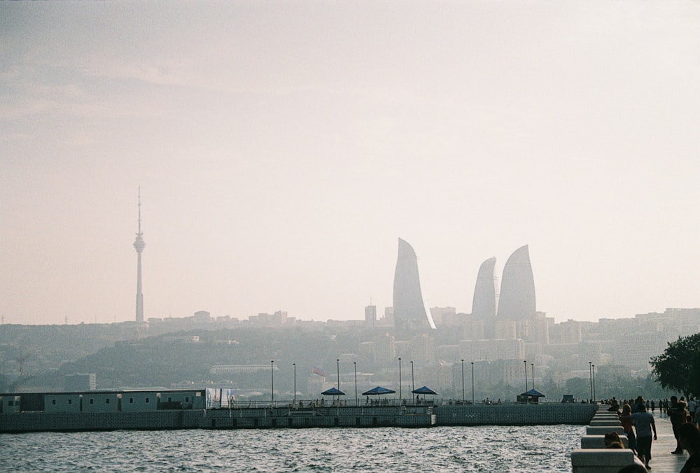 a body of water with a city in the background