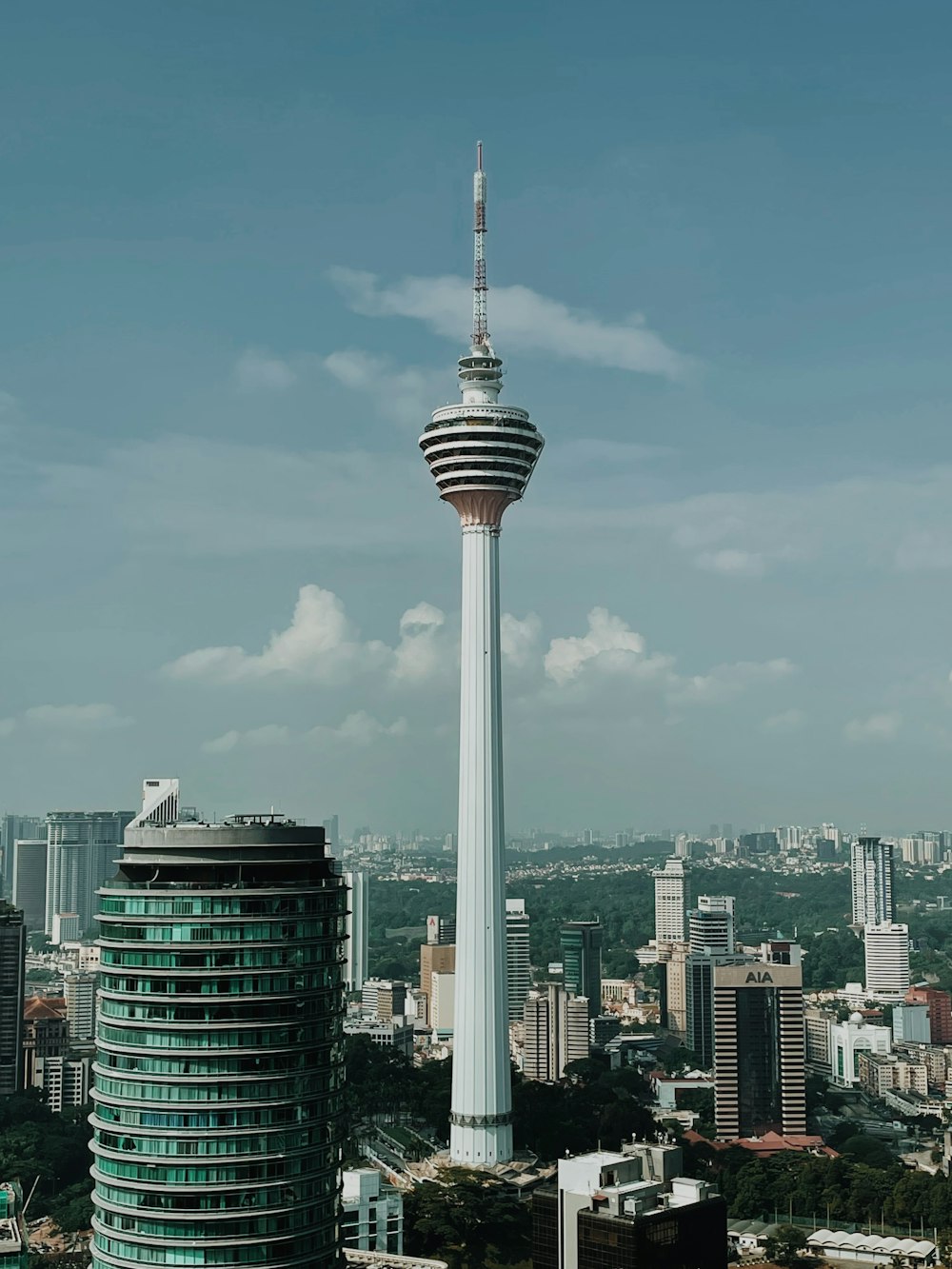 a tall tower with a sky scraper on top of it