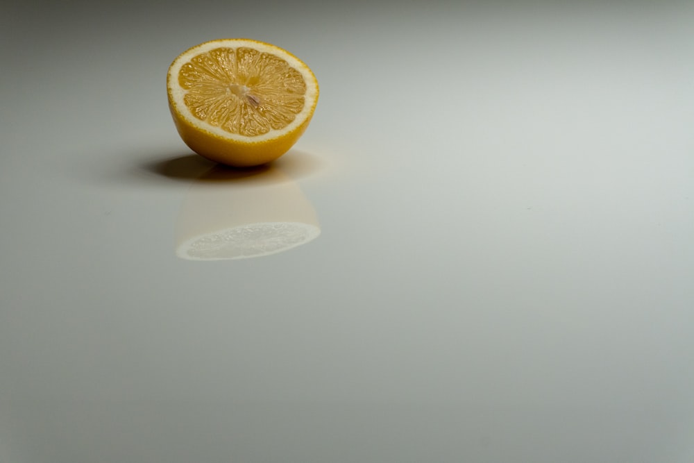 a half eaten orange sitting on top of a table