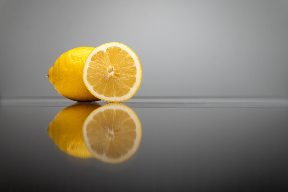 a couple of lemons sitting on top of a table