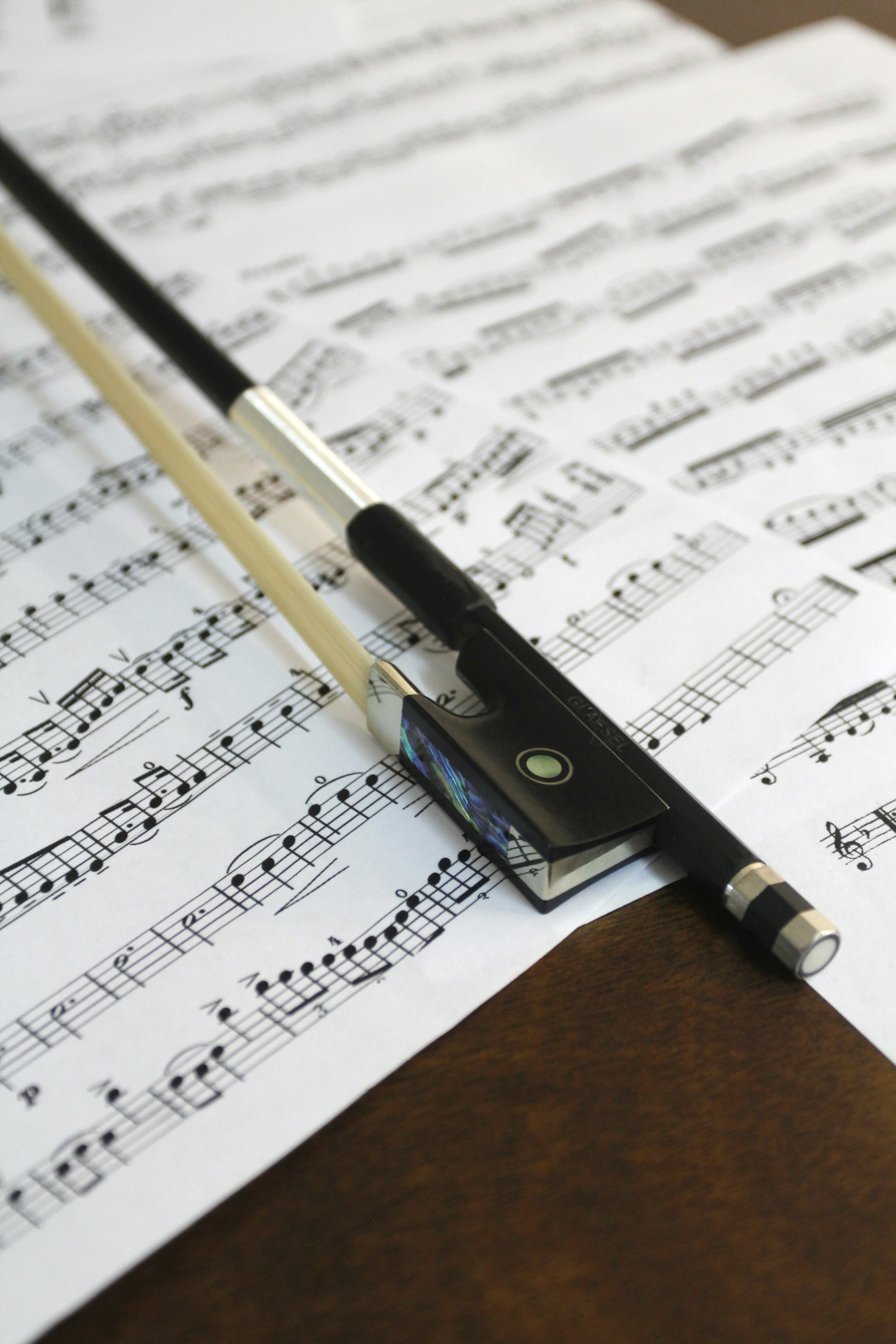 a pen sitting on top of sheet music