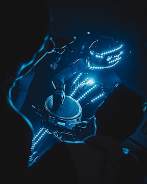 a futuristic vehicle with a blue light around it